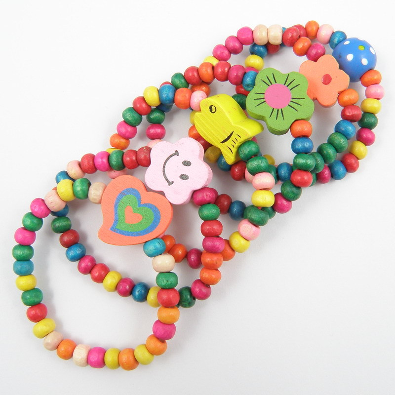 Los niños del color caramelo pulsera de madera juguete elástico cuerda mano bebé joyería AliExpress envío