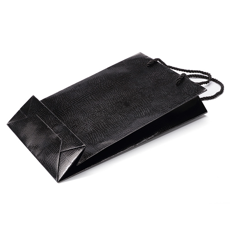 现货新款压纹卡纸礼品袋黑色特种纸通用纸袋蜥蜴纹购物手提袋直销