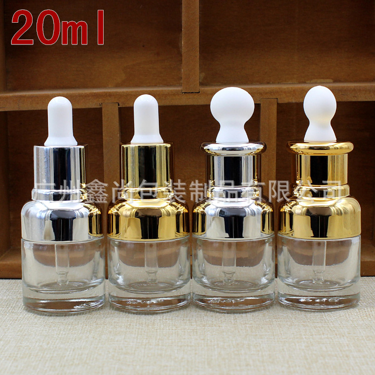 Botella de vidrio transparente de alta gama 20ml botella de esencia cabeza de goma plana botella de aceite esencial botella cuentagotas botella de líquido cosmético vacío