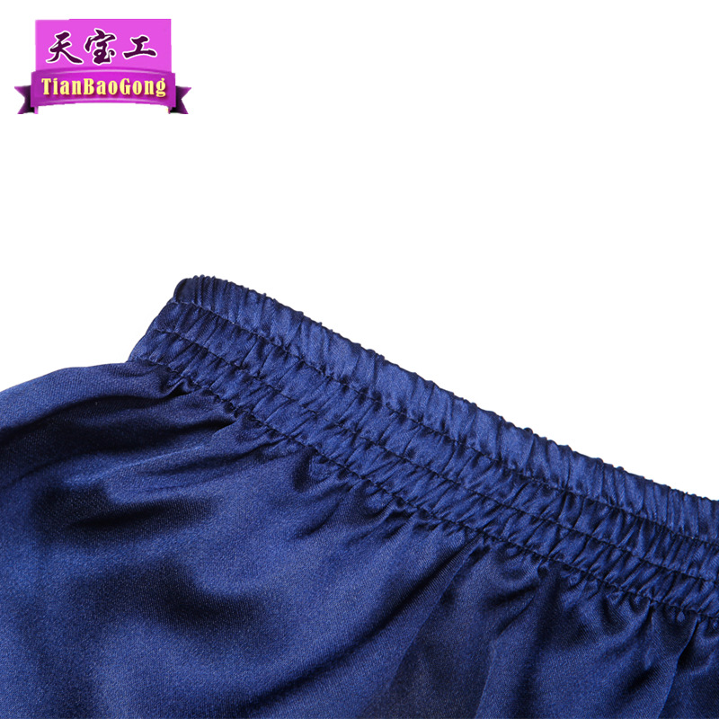 Satén de seda de cinco puntos de color sólido boxeadores brillantes pantalones de playa de verano sueltos ocasionales pantalones de pijama de hombres delgados lisos