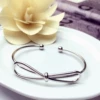 With bow, silver