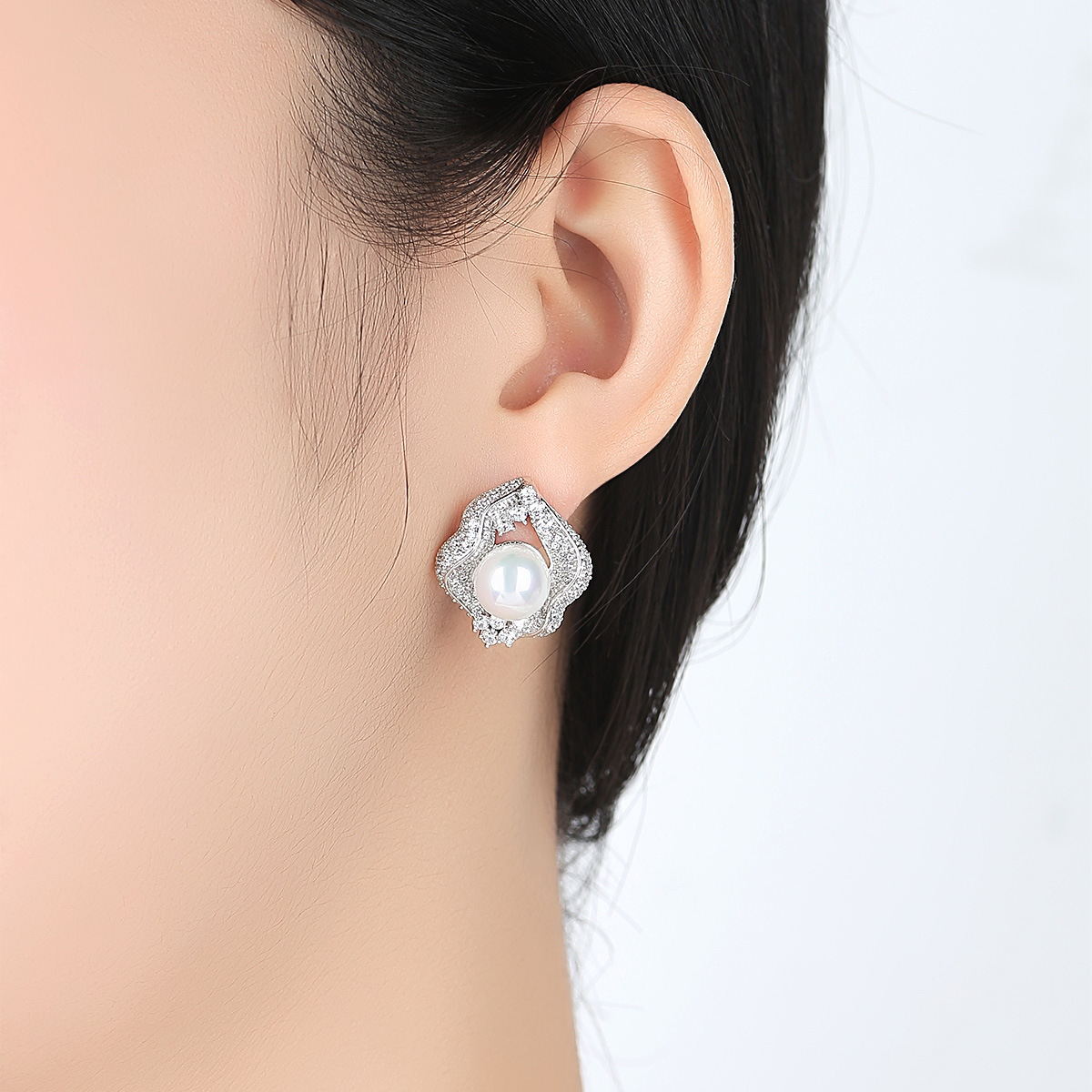 Copper earrings from pearl with zircon