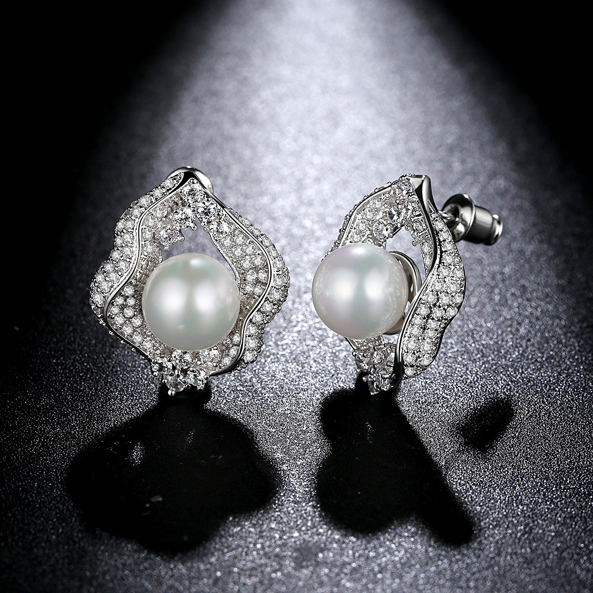 Copper earrings from pearl with zircon