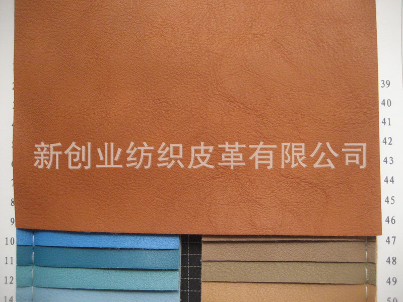 批发人造革动漫卡通服装革荔枝纹 细纹箱包沙发革 仿羊皮包袋皮料