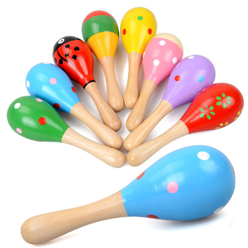 Baby holding educational toy Orff musical instrument wooden cartoon maracas wooden maracas exercise auditory rattle