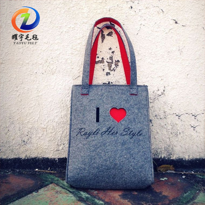 毛毡包女生手提包毛毡收纳包便携手提包镂空心形毛毡袋可加印Logo