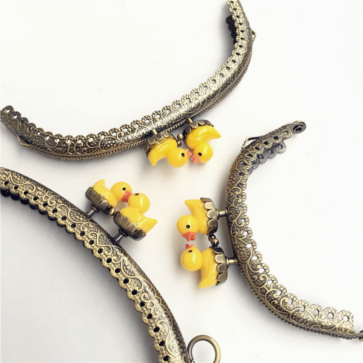 20% de descuento: 8.5CM arco de encaje en relieve pato amarillo oro cabeza de pato animal