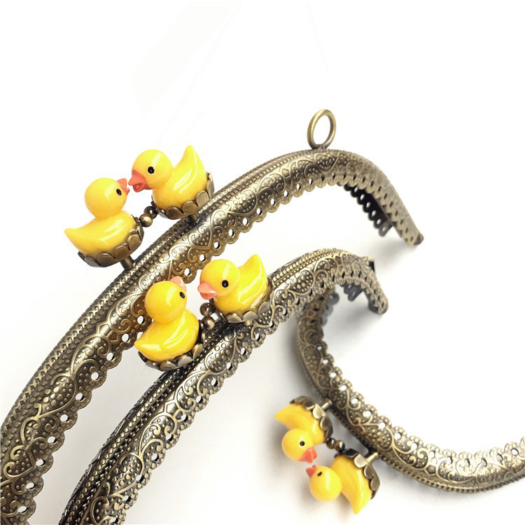 20% de descuento: 8.5CM arco de encaje en relieve pato amarillo oro cabeza de pato animal