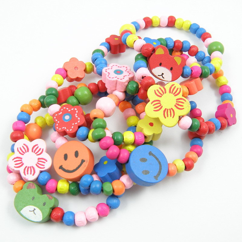 Los niños del color caramelo pulsera de madera juguete elástico cuerda mano bebé joyería AliExpress envío