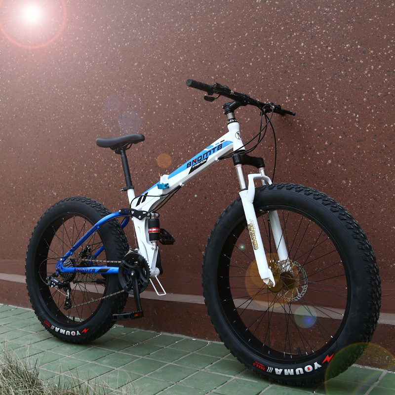 Fábrica al por mayor plegable nieve bicicleta de montaña de velocidad variable amortiguador freno de disco ensanchado neumático grande bicicleta de regalo
