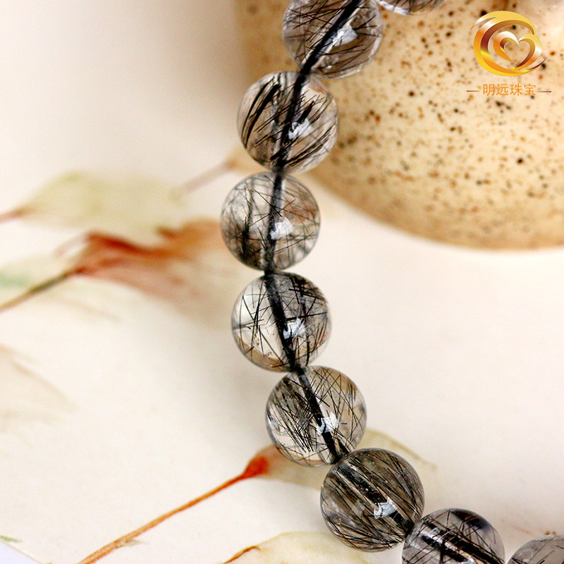 El pelo negro natural de la pulsera cristalina al por mayor del pelo negro de la pulsera cristalina del pelo bueno menos pelo 5A más 3A dos clases de cristal negro del pelo