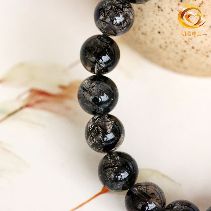 El pelo negro natural de la pulsera cristalina al por mayor del pelo negro de la pulsera cristalina del pelo bueno menos pelo 5A más 3A dos clases de cristal negro del pelo