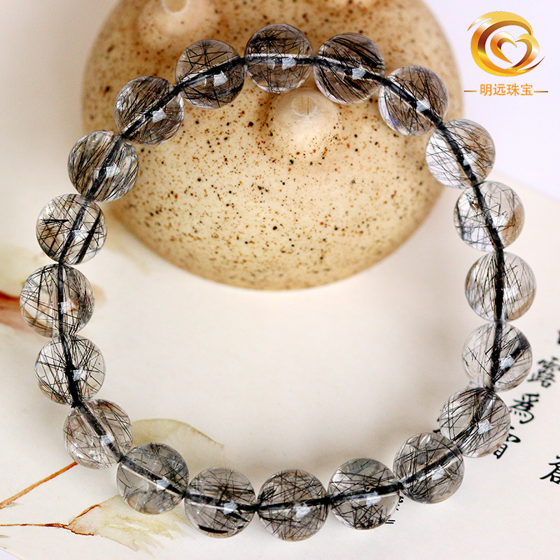 El pelo negro natural de la pulsera cristalina al por mayor del pelo negro de la pulsera cristalina del pelo bueno menos pelo 5A más 3A dos clases de cristal negro del pelo