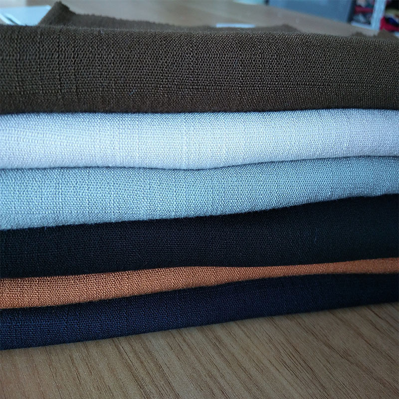 现货供应人造棉竹节布 21S弹力竹节布 经纬竹节服装用布多色可选