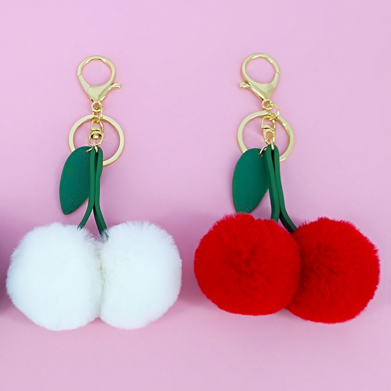 Cross-border exclusive hot selling fruit pu cherry leaves imitation Rex rabbit fur ball keychain pendant bag ornaments wholesale