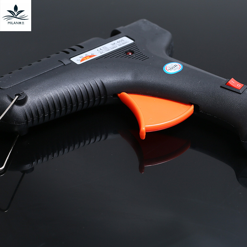 Milán nuevo material de embalaje de flores pistola de pegamento de fusión en caliente palo de pegamento ramo de embalaje pistola de pegamento eléctrica al por mayor 100