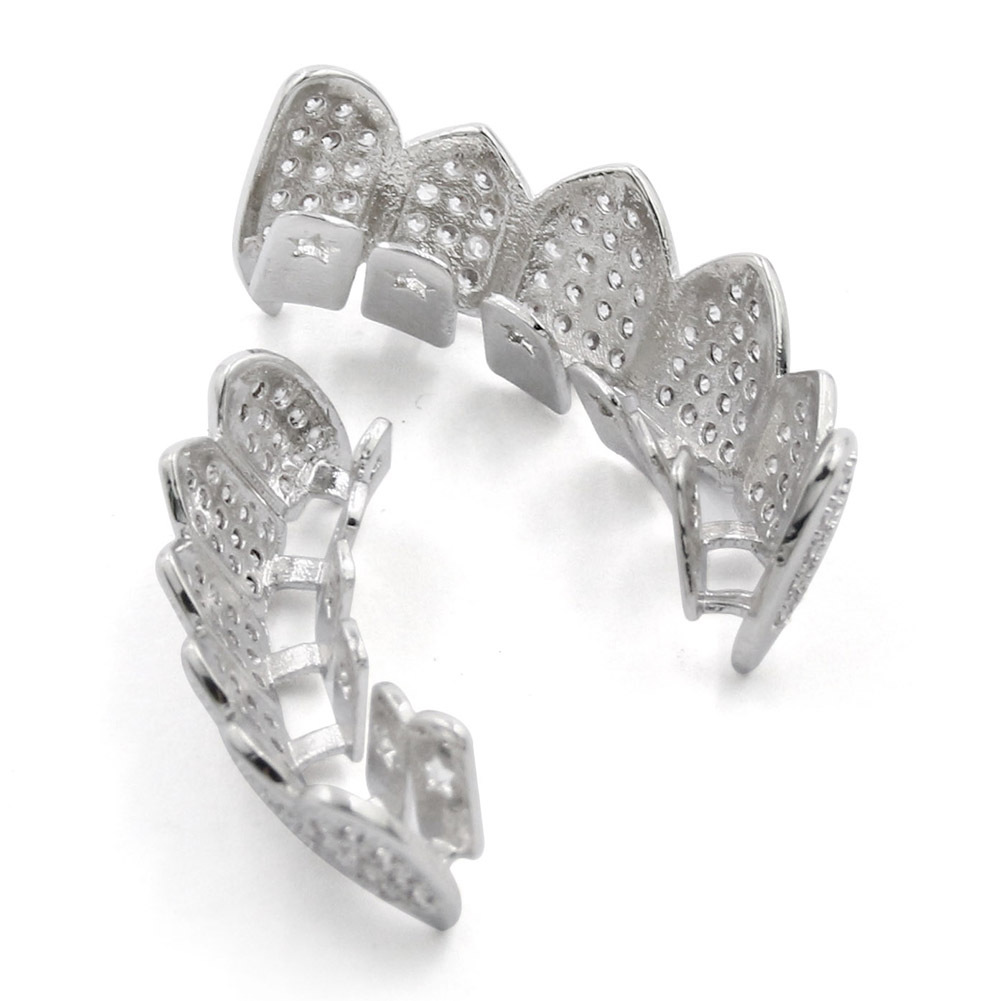 Cross-border INS popular hiphop europeo y americano hip hop oro tirantes dientes puntiagudos joyería micro incrustaciones de oro dientes decorativos fabricante