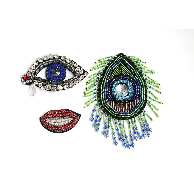 厂家供应新款重工眼睛嘴唇钉珠服装辅料