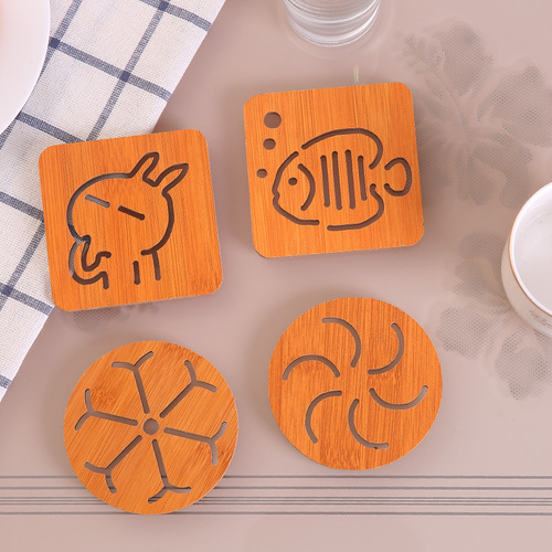 Wooden coasters, hollow anti-slip pot and bowl mats, kitchen tableware anti-scalding heat insulation mats, cartoon cute dining table mats wholesale