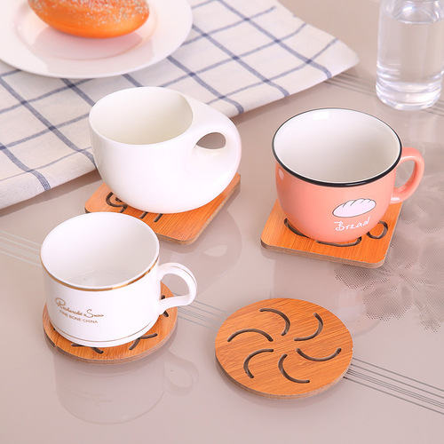 Wooden coasters, hollow anti-slip pot and bowl mats, kitchen tableware anti-scalding heat insulation mats, cartoon cute dining table mats wholesale