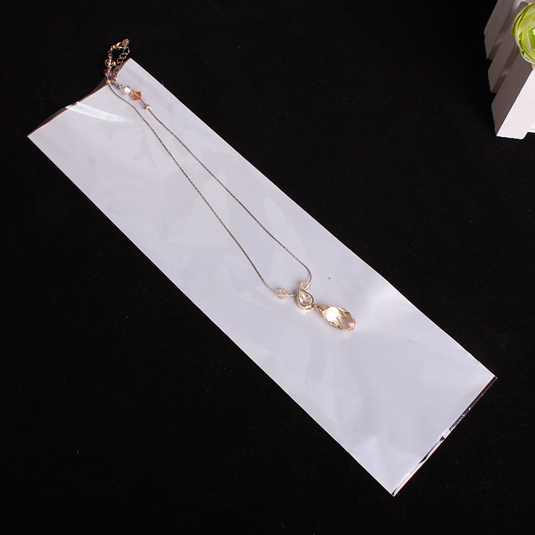 厂家直销  包装饰品透明opp珠光膜三层加厚袋子 平口 6*27.5cm