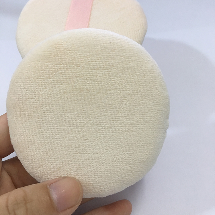 メーカー直売の肌の色の純綿のパフの乾燥した粉の爽やかな粉は手のリボンのパフの蜜の粉を切って化粧の道具をかきます。|undefined