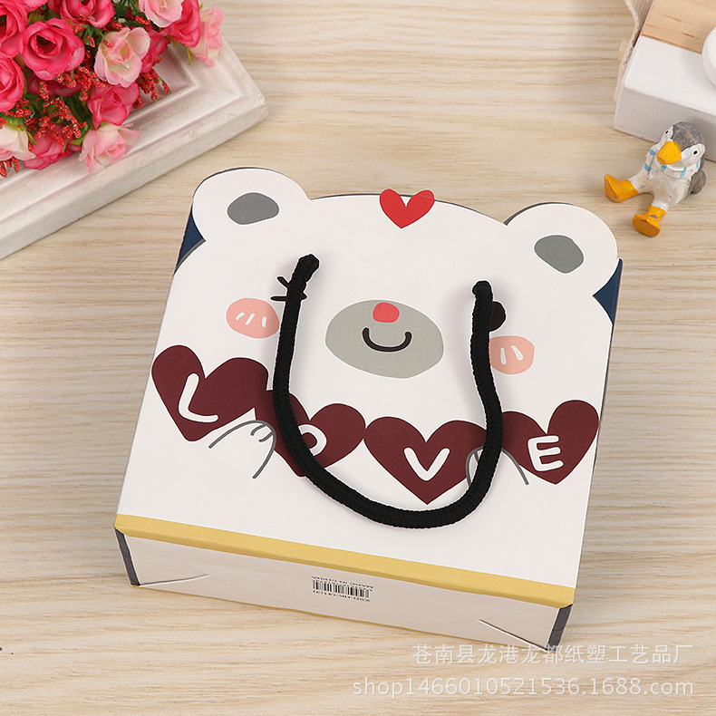 创意卡通礼品手提袋 购物服装白卡纸通用包装纸袋批发环保