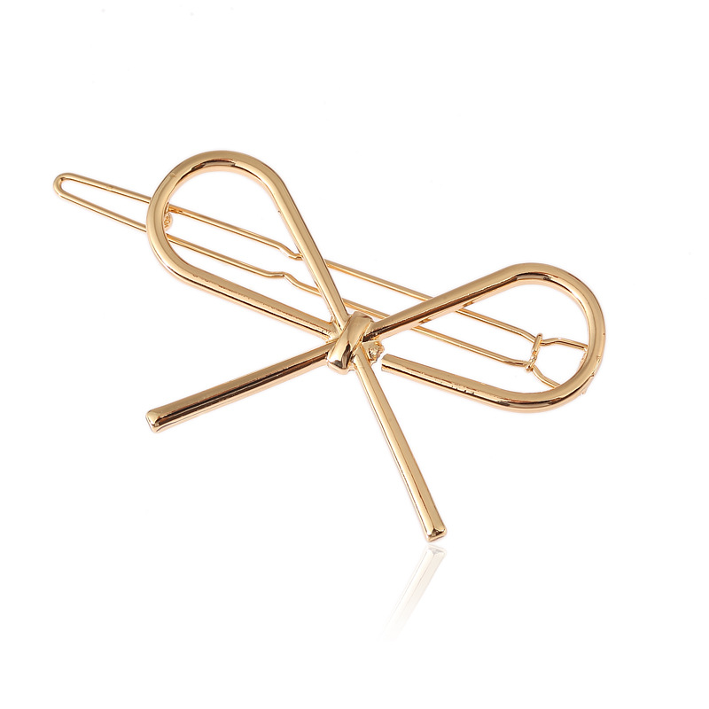 Golden hairgrip with bow