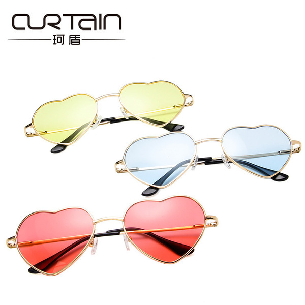 Retro fashionable sunglasses heart-shaped