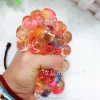 Colorful beads squeezing grape balls