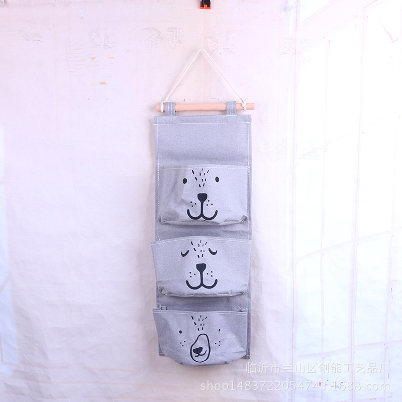 Expresión de dibujos animados de algodón y lino Bolsa colgante de almacenamiento de una pieza de tres bolsillos Bolsa colgante de almacenamiento de semicírculo Bolsa colgante decorativa Bolsa colgante