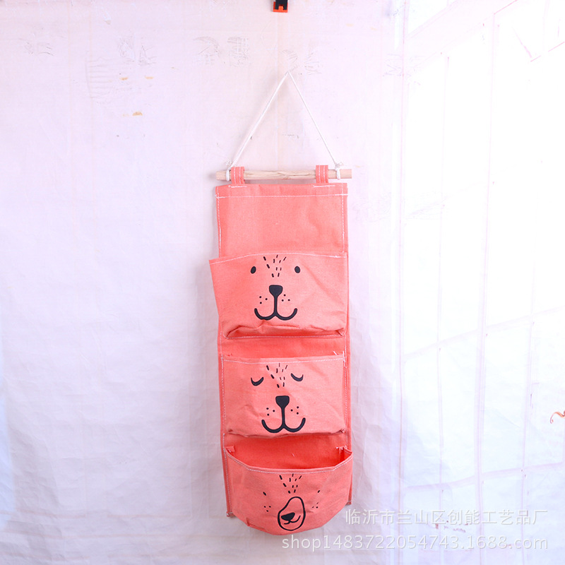 Expresión de dibujos animados de algodón y lino Bolsa colgante de almacenamiento de una pieza de tres bolsillos Bolsa colgante de almacenamiento de semicírculo Bolsa colgante decorativa Bolsa colgante