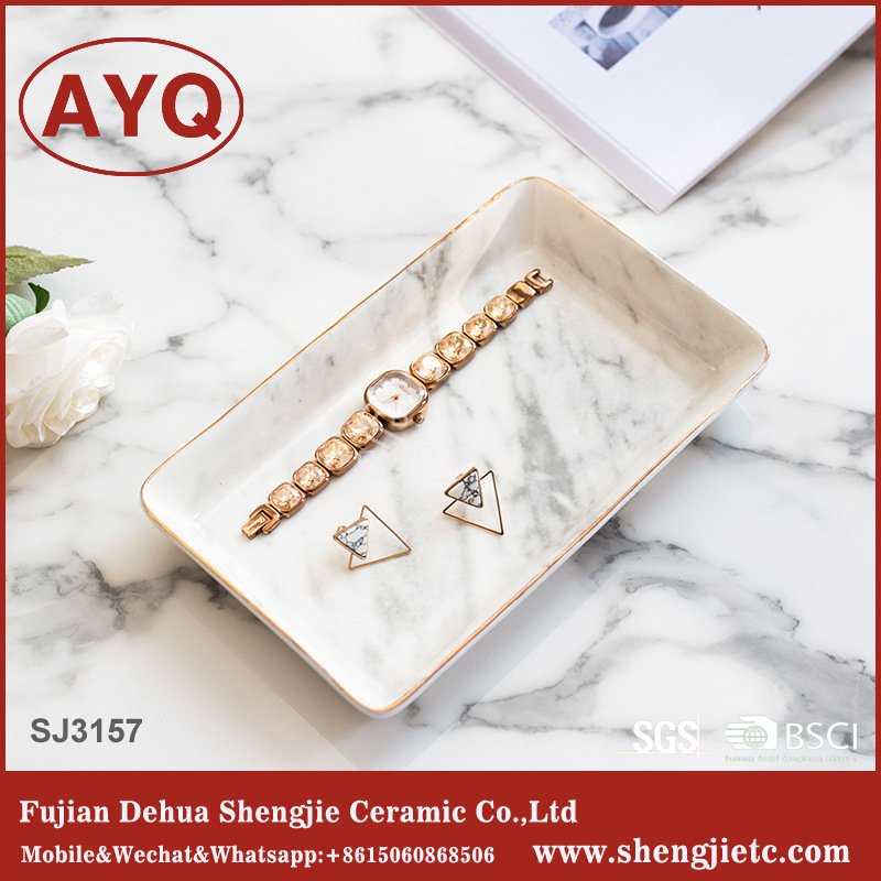 メーカー卸売りの流れ北欧風大理石紋描金辺陶磁器アクセサリー盤デスクトップ化粧品収納盤