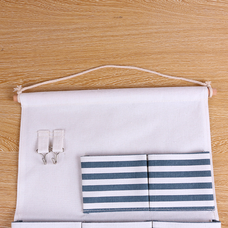 Comercio exterior algodón y lino 8 bolsillos bolsa colgante de almacenamiento de rayas bolsa de almacenamiento de baño bolsa de almacenamiento de pared botón colgante bolsa fabricante
