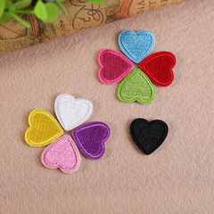 Embroidered patch with a small heart, perfect for decorating clothing and adding a cute touch