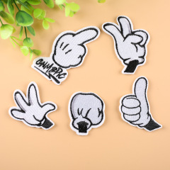 Embroidered patch with white hand-stitched design, suitable for clothing decoration, adhesive-backed appliqué patch for iron-on transfer.