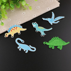 Elegant and adorable small dinosaur embroidery patch with computerized embroidery—perfect for clothing decoration, embellishment, or as a fully embroidered label.