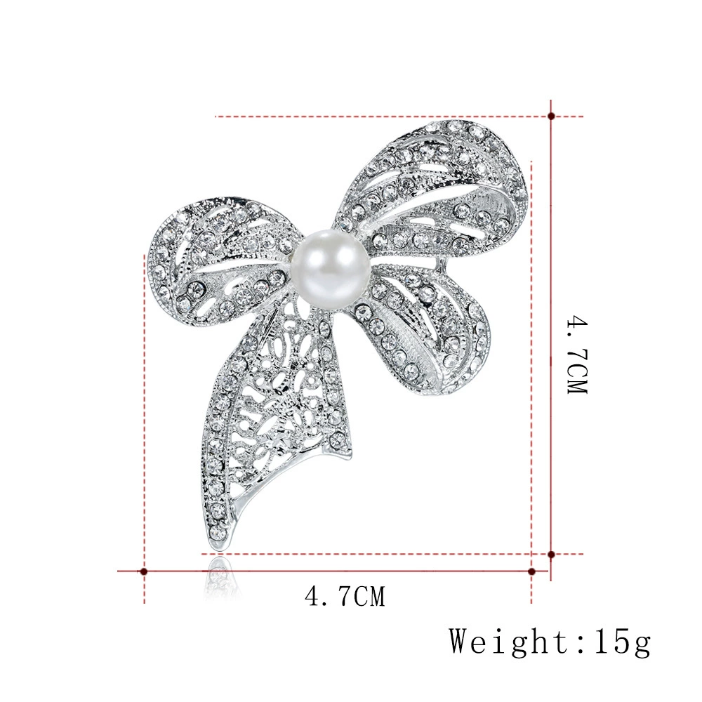 White brooch with bow lapel pin, bag accessory