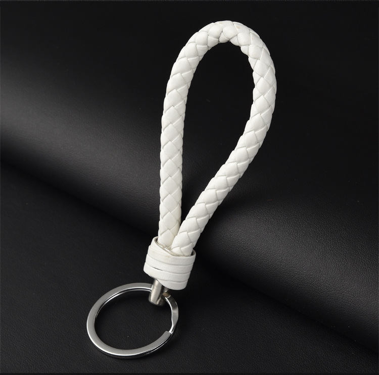 Cuerda de cuero llavero pareja llavero coche creativo tejido a mano hombres y mujeres llavero pequeño regalo al por mayor