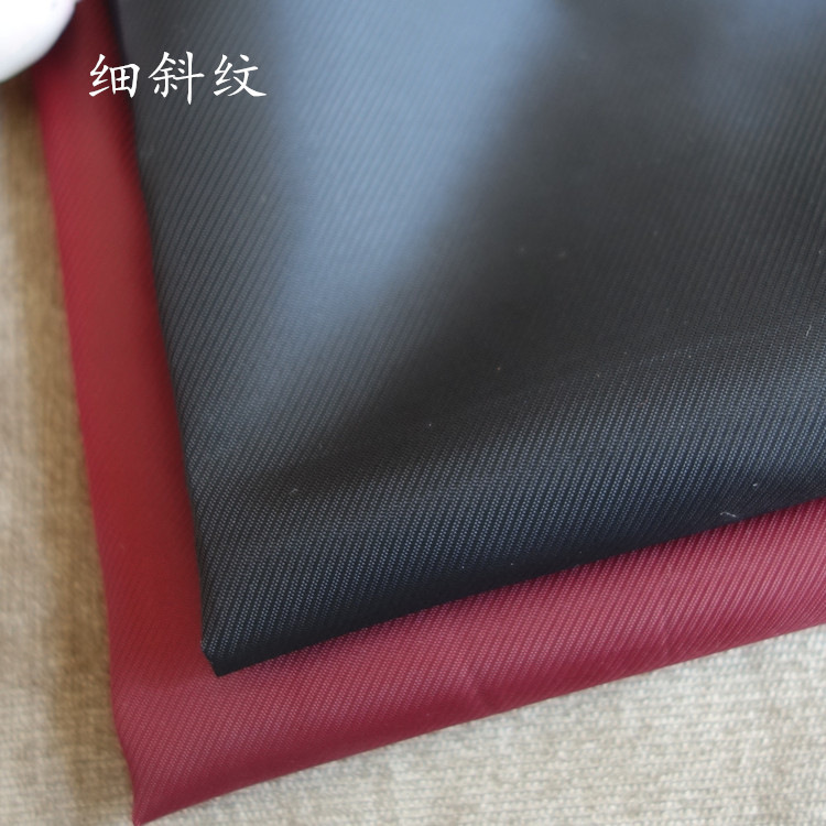 现货细斜纹涤纶服装箱包中斜纹里布全涤斜纹布口袋布提花里料