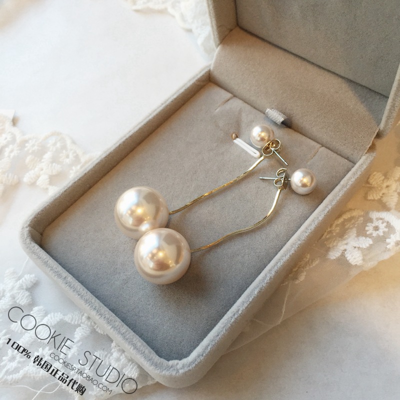 Fashionable universal earrings from pearl with tassels