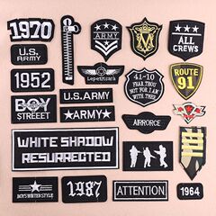 Embroidered patch with a small black logo, trendy for clothes and fashion accessories.