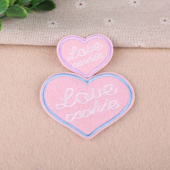 Embroidered patch with cute letters, pink heart, stylish design for computers, clothing decoration and fabric patches