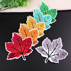 Embroidered fabric patches with computerized floral designs, featuring maple leaves, as stylish fashion accessories for clothing decoration.