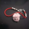 Red rope pink cat