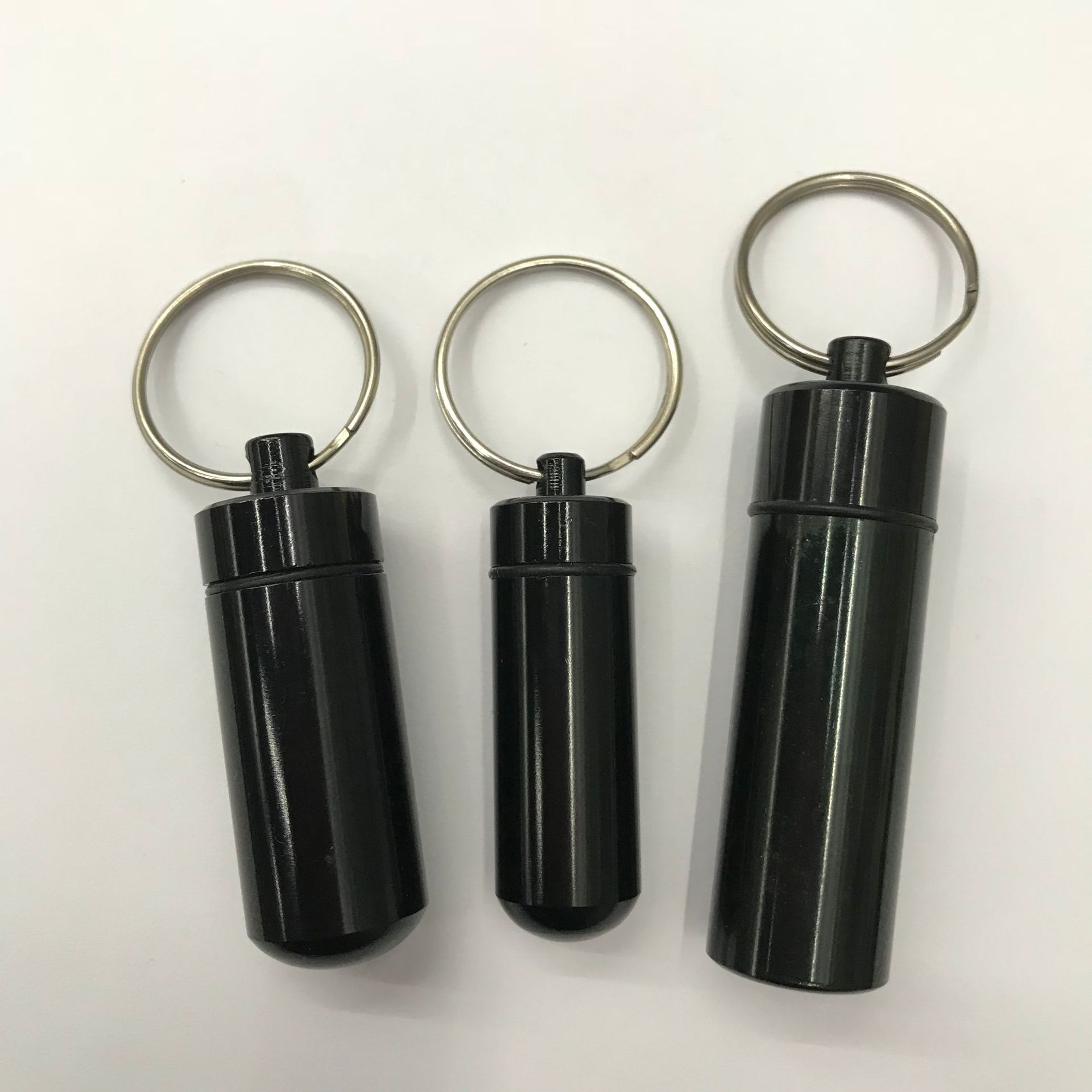 Mini impermeable pequeña medicina puede Primeros Auxilios píldora botella sellada Botella de medicina al aire libre llavero de aleación de aluminio botella colgante