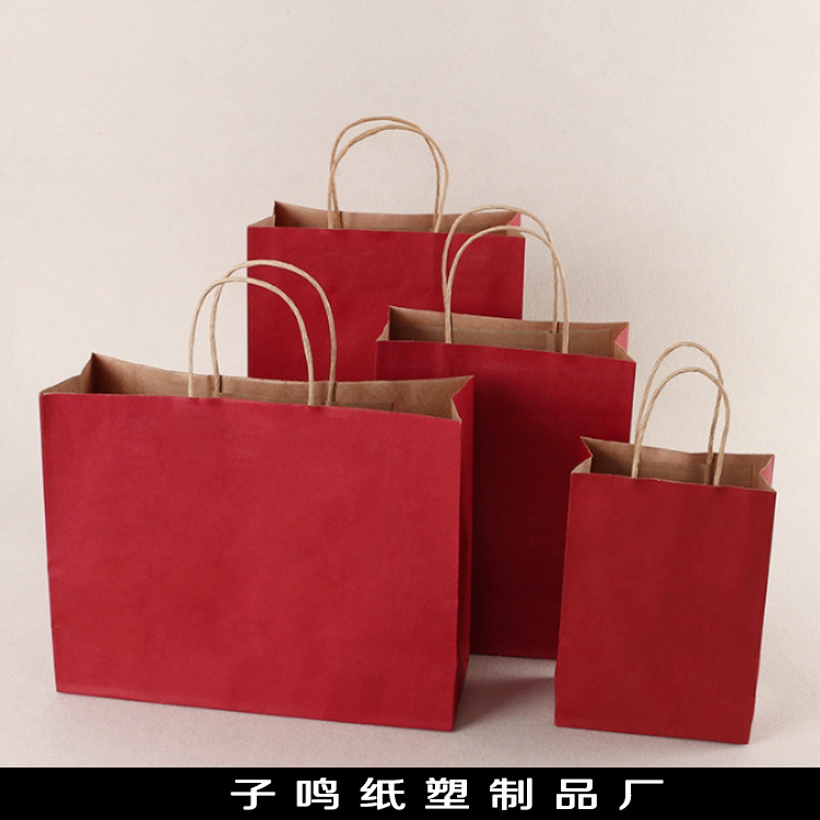 厂家直销现货牛皮纸袋白牛皮纸袋袋子服装纸袋可加印LOGO白袋