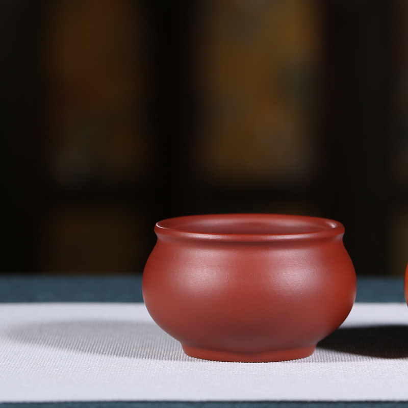 Suministro directo de fábrica Master Cup productos genuinos Yixing mineral en bruto arena púrpura taza personal hecho a mano tarro redondo taza de té entrega de una sola pieza