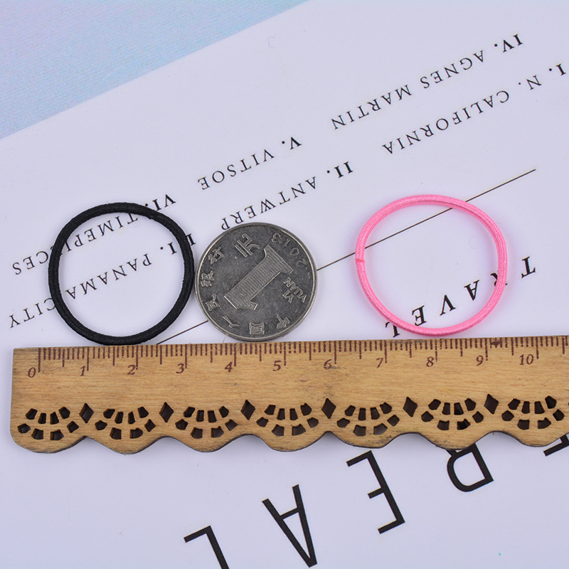 Venta caliente en línea cuerda de pelo 100 piezas banda de pelo para niños bebé color caramelo cuerda de pelo niña banda de goma accesorios para el cabello al por mayor