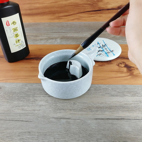 Multifunctional ceramic inkwell with lid, stationery set for storing ink, color mixing plate, ink dish, pen rest, and ink tray.